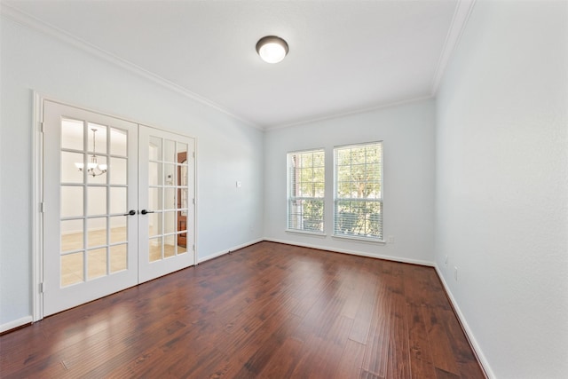 unfurnished room featuring baseboards, french doors, dark wood finished floors, and crown molding