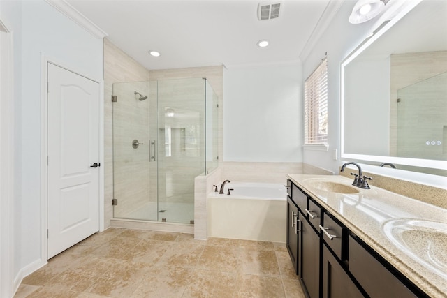 full bathroom with a garden tub, a sink, visible vents, ornamental molding, and a shower stall