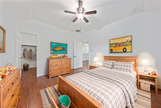 bedroom featuring vaulted ceiling, wood finished floors, and visible vents