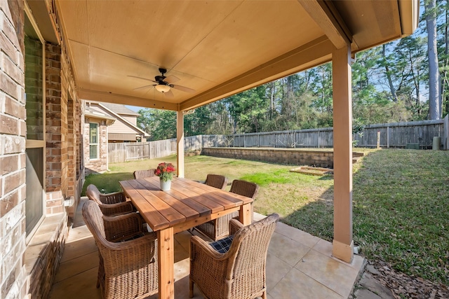 view of patio featuring ceiling fan, a fenced backyard, and outdoor dining area