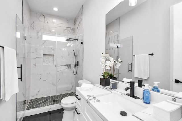 full bath with toilet, recessed lighting, a marble finish shower, and vanity