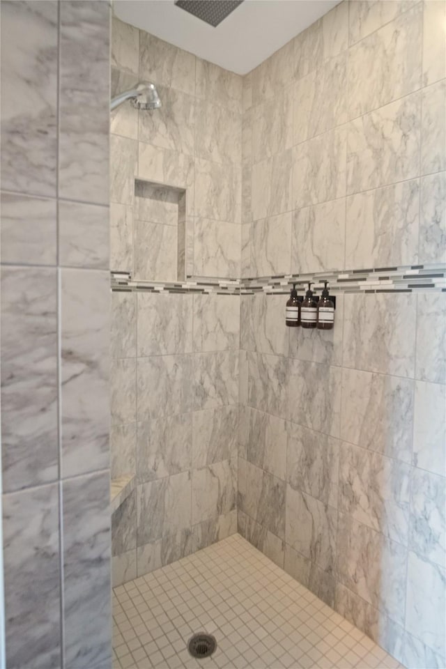 full bathroom with a tile shower