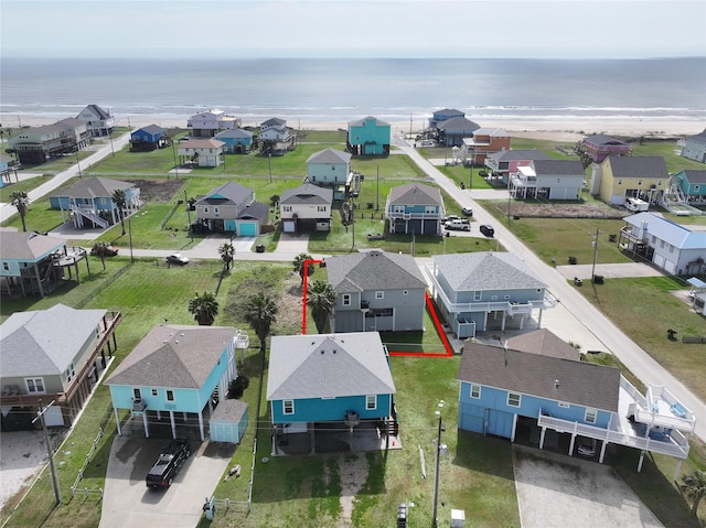 birds eye view of property with a residential view and a water view