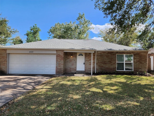 ranch-style home featuring a garage, brick siding, and a front lawn