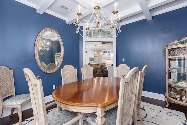 dining room featuring an inviting chandelier, visible vents, baseboards, and wood finished floors