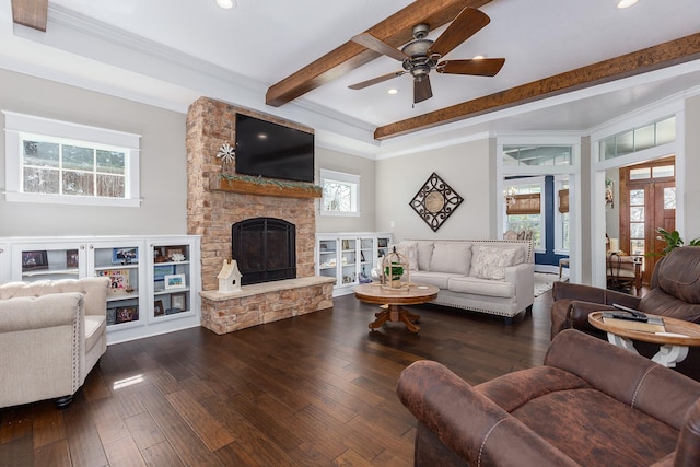 living room featuring a stone fireplace, hardwood / wood-style floors, beamed ceiling, and recessed lighting