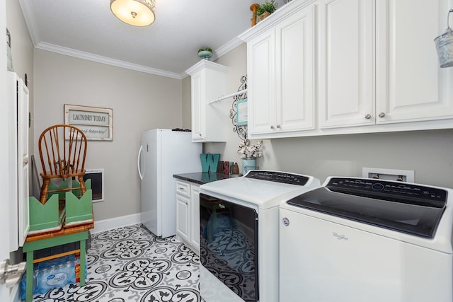 washroom with cabinet space, light tile patterned floors, baseboards, washer and clothes dryer, and crown molding