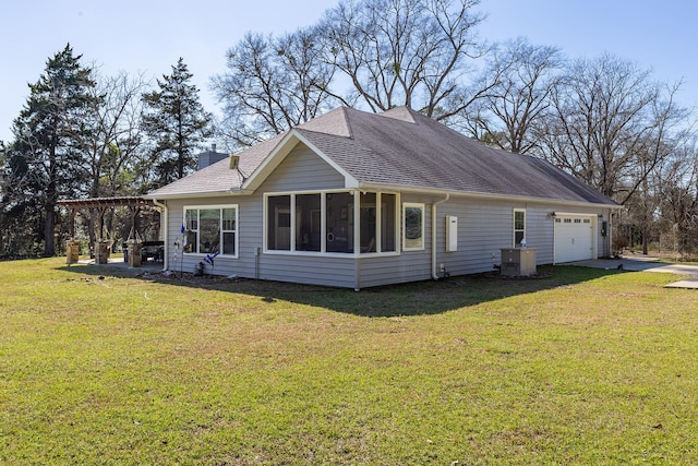 back of property with central air condition unit, a garage, a shingled roof, a lawn, and a pergola