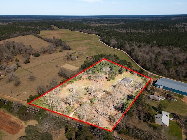 birds eye view of property featuring a rural view