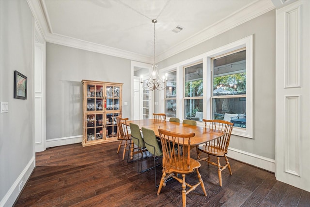 dining area with crown molding, visible vents, a chandelier, and dark wood-type flooring