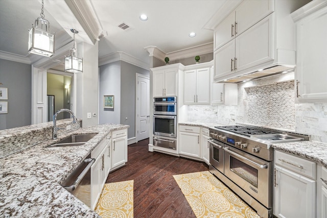 kitchen featuring visible vents, white cabinets, stainless steel appliances, crown molding, and a sink