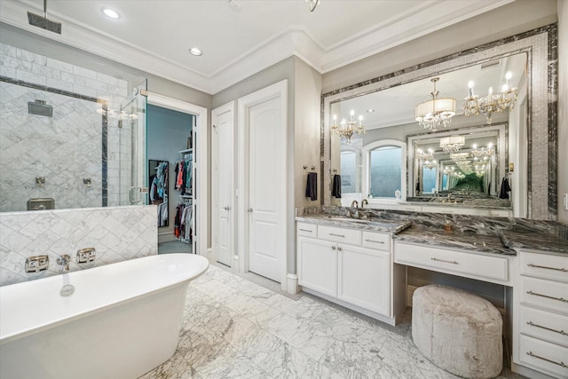 full bathroom featuring a shower stall, crown molding, a freestanding bath, and vanity