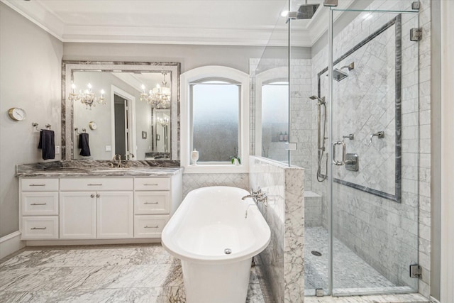 full bathroom featuring a stall shower, crown molding, a freestanding bath, and vanity