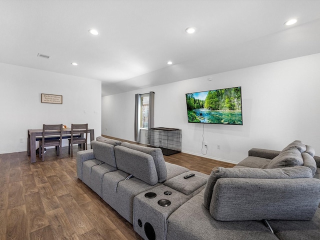 living room with visible vents, dark wood-style flooring, and recessed lighting