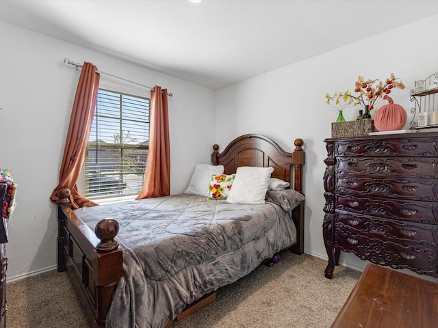 carpeted bedroom with baseboards