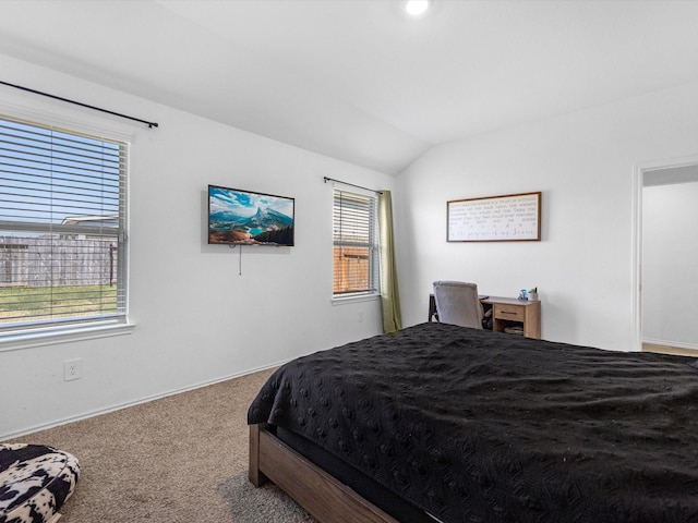 carpeted bedroom featuring lofted ceiling