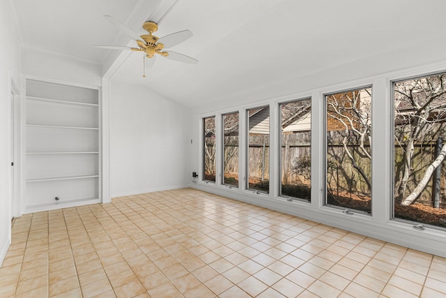 unfurnished sunroom with ceiling fan and lofted ceiling