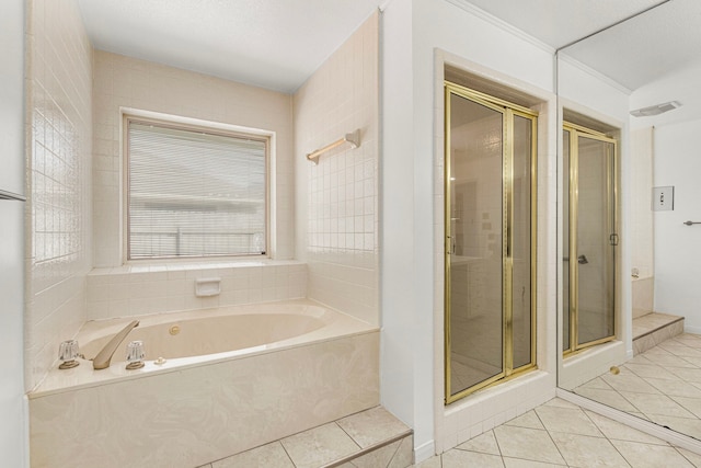 full bathroom with tile patterned flooring, visible vents, a garden tub, and a shower stall