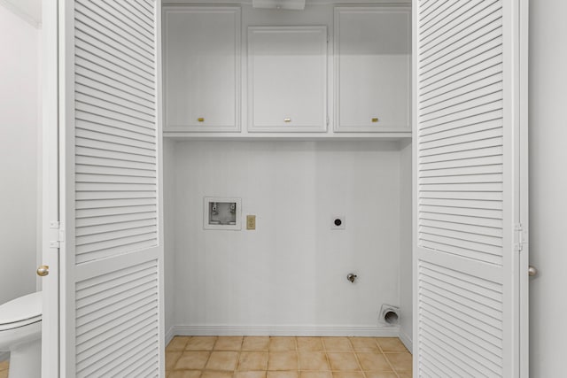 clothes washing area with cabinet space, baseboards, washer hookup, and hookup for an electric dryer