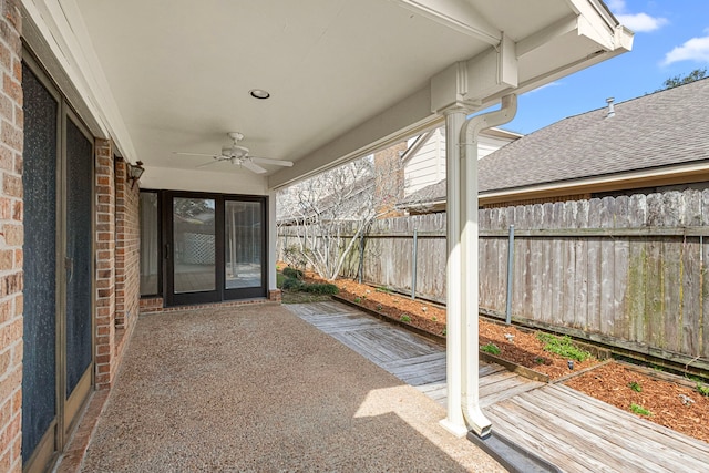 view of patio featuring fence and ceiling fan