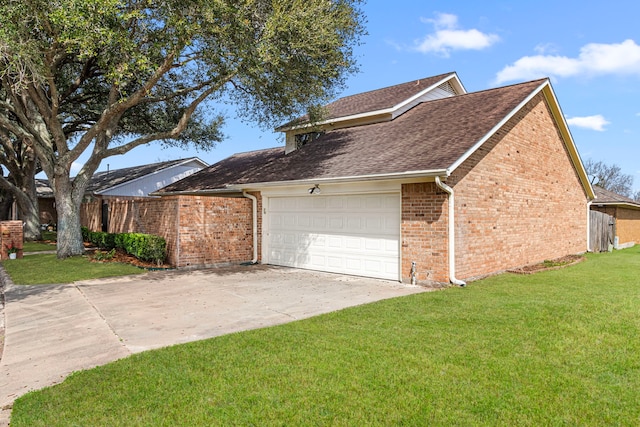 view of side of home featuring an attached garage, a yard, concrete driveway, and brick siding