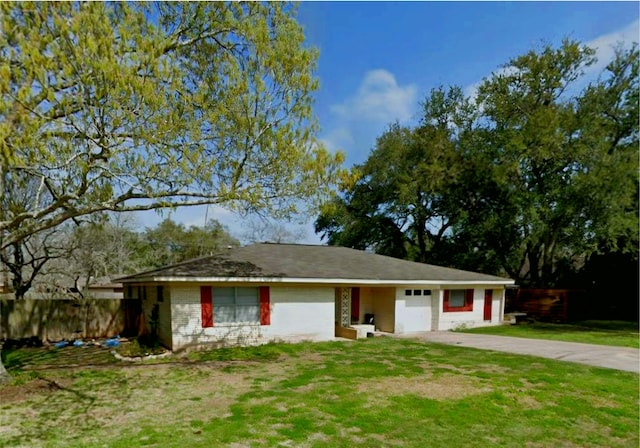 single story home featuring an attached garage, fence, concrete driveway, and a front yard