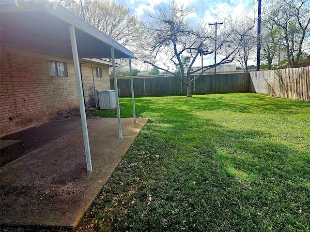 view of yard with a fenced backyard and a patio