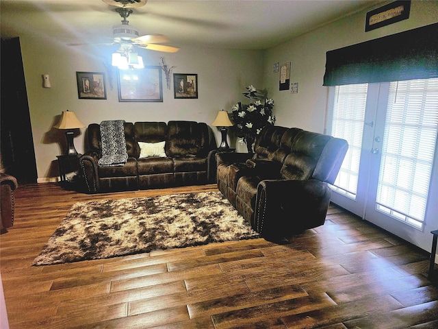 living room with a ceiling fan, french doors, and wood finished floors