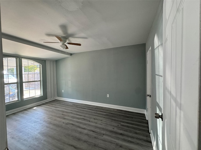 unfurnished bedroom featuring dark wood-style floors, ceiling fan, and baseboards