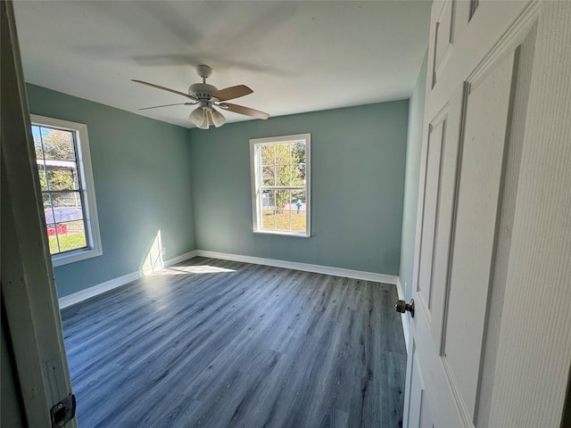 unfurnished bedroom featuring a ceiling fan, baseboards, and wood finished floors