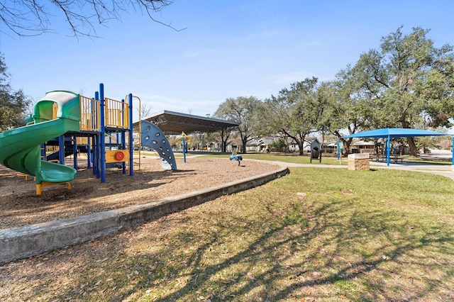 community jungle gym featuring a yard