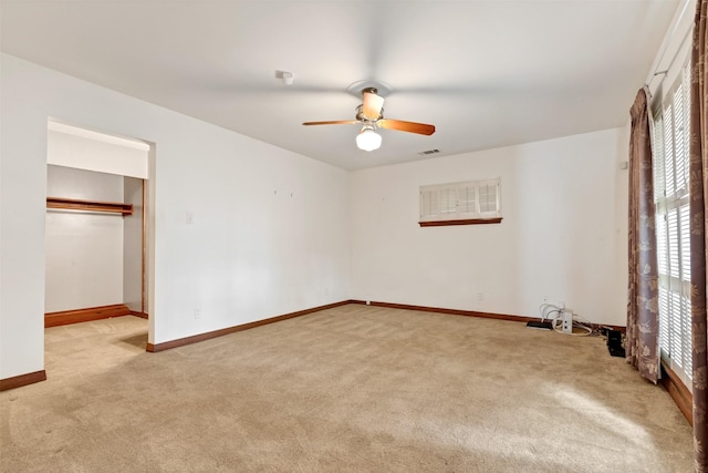 unfurnished bedroom with visible vents, a ceiling fan, baseboards, and carpet floors