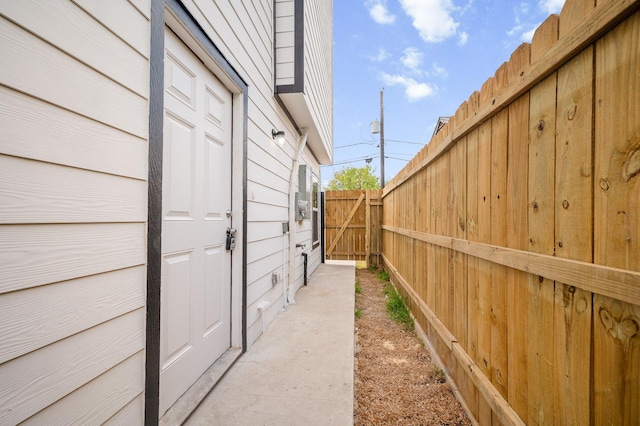 view of side of property featuring fence