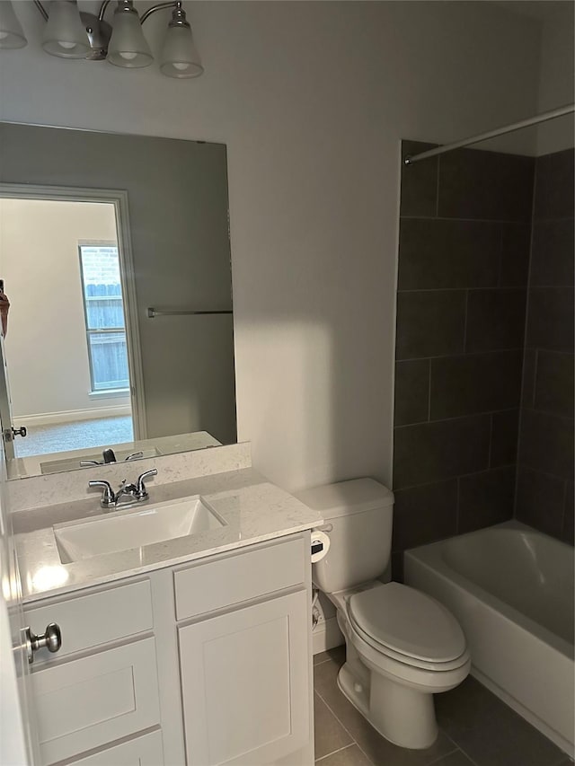 full bathroom featuring toilet, vanity, shower / washtub combination, and tile patterned floors