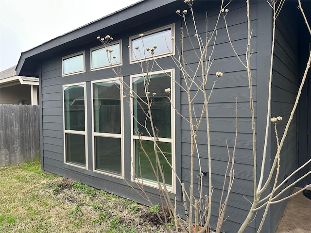 view of property exterior with fence