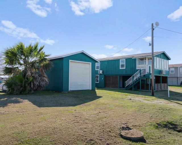 1821 County Road 201, Sargent, TX 77414 - view of grassy yard featuring stairway, an outdoor structure, and a garage