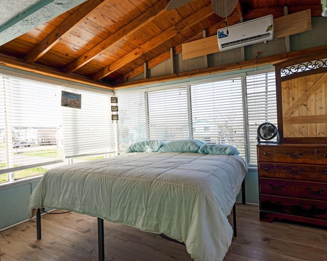 1821 County Road 201, Sargent, TX 77414 - bedroom featuring a wall mounted AC, hardwood / wood-style floors, and wooden ceiling