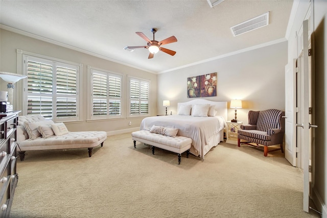 bedroom with multiple windows, visible vents, and crown molding