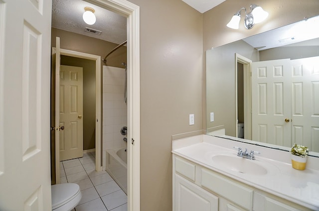 full bath with toilet, visible vents, a textured ceiling, and tile patterned floors