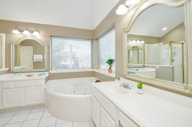 full bathroom with vaulted ceiling, a sink, a shower stall, tile patterned flooring, and a tub with jets