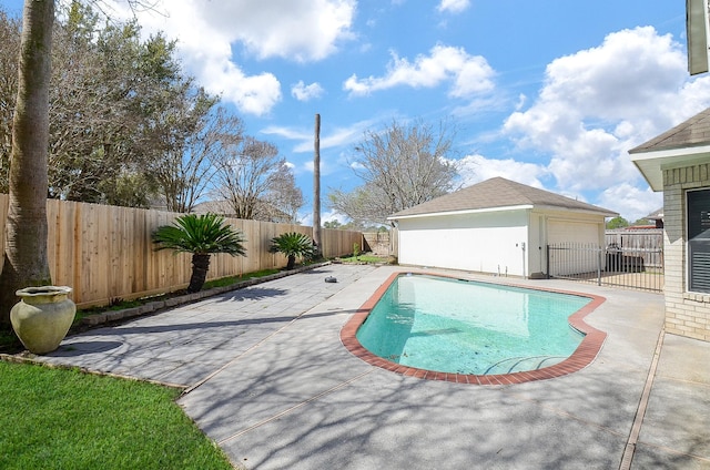 view of swimming pool with a fenced in pool, an outbuilding, a fenced backyard, and a patio