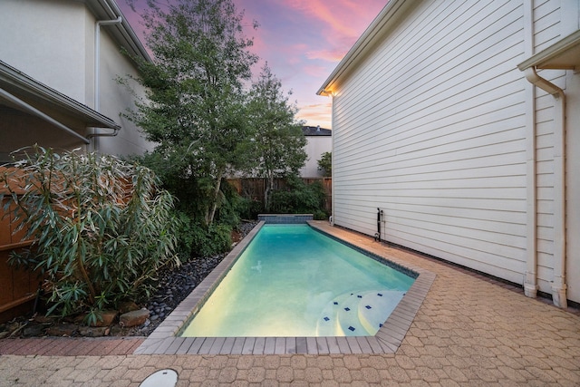 view of pool featuring a fenced backyard and a patio area