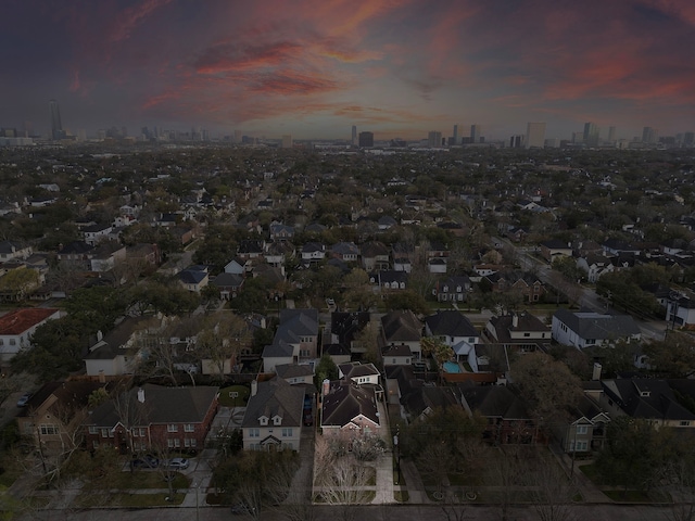 birds eye view of property with a city view