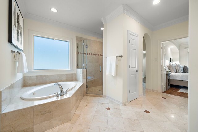 full bath featuring a bath, a shower stall, ensuite bath, and crown molding