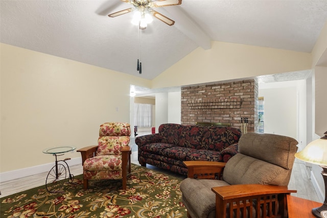 living room featuring baseboards, a ceiling fan, lofted ceiling with beams, wood finished floors, and a textured ceiling