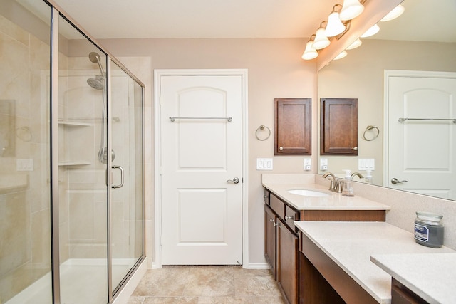bathroom featuring a stall shower and vanity