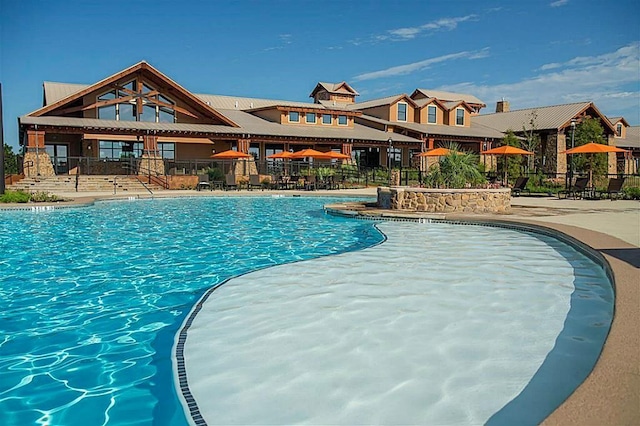 pool featuring a patio and fence