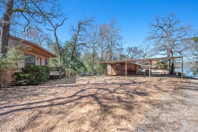 view of yard with a wooden deck