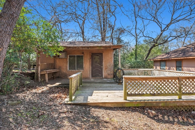 wooden deck featuring an outbuilding