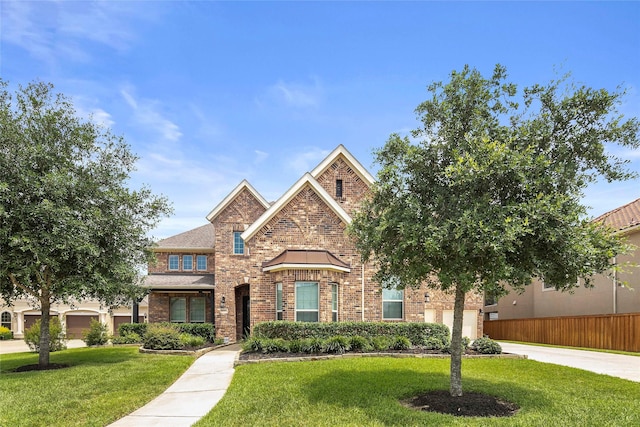 26407 Katy Springs Ln, Katy, TX 77494 - view of front of house with driveway, a front yard, and brick siding